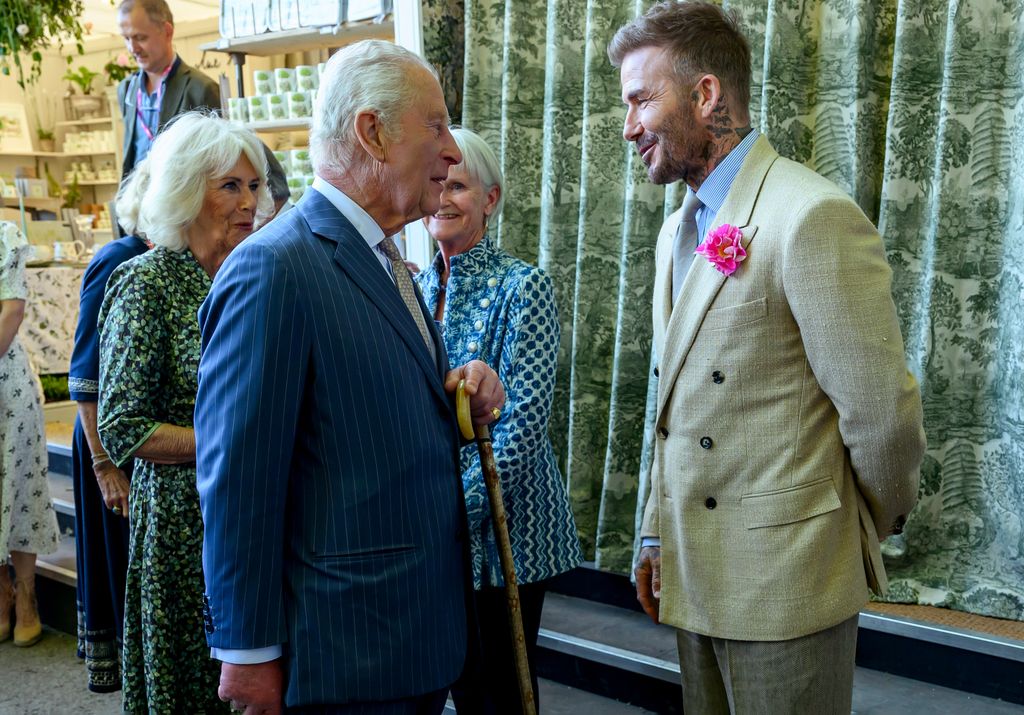 Queen Camilla and King Charles speaking to David Beckham