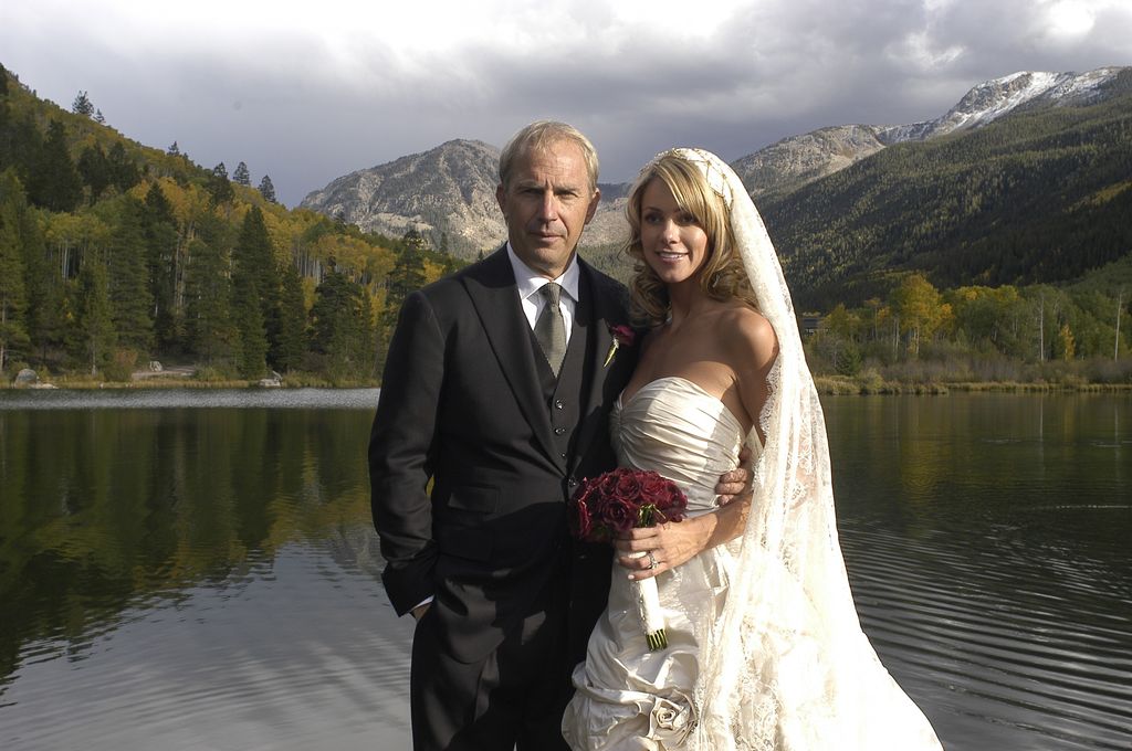 Actor Kevin Costner poses with his new wife Christine Baumgartner during their private wedding at his ranch in September 25, 2004 