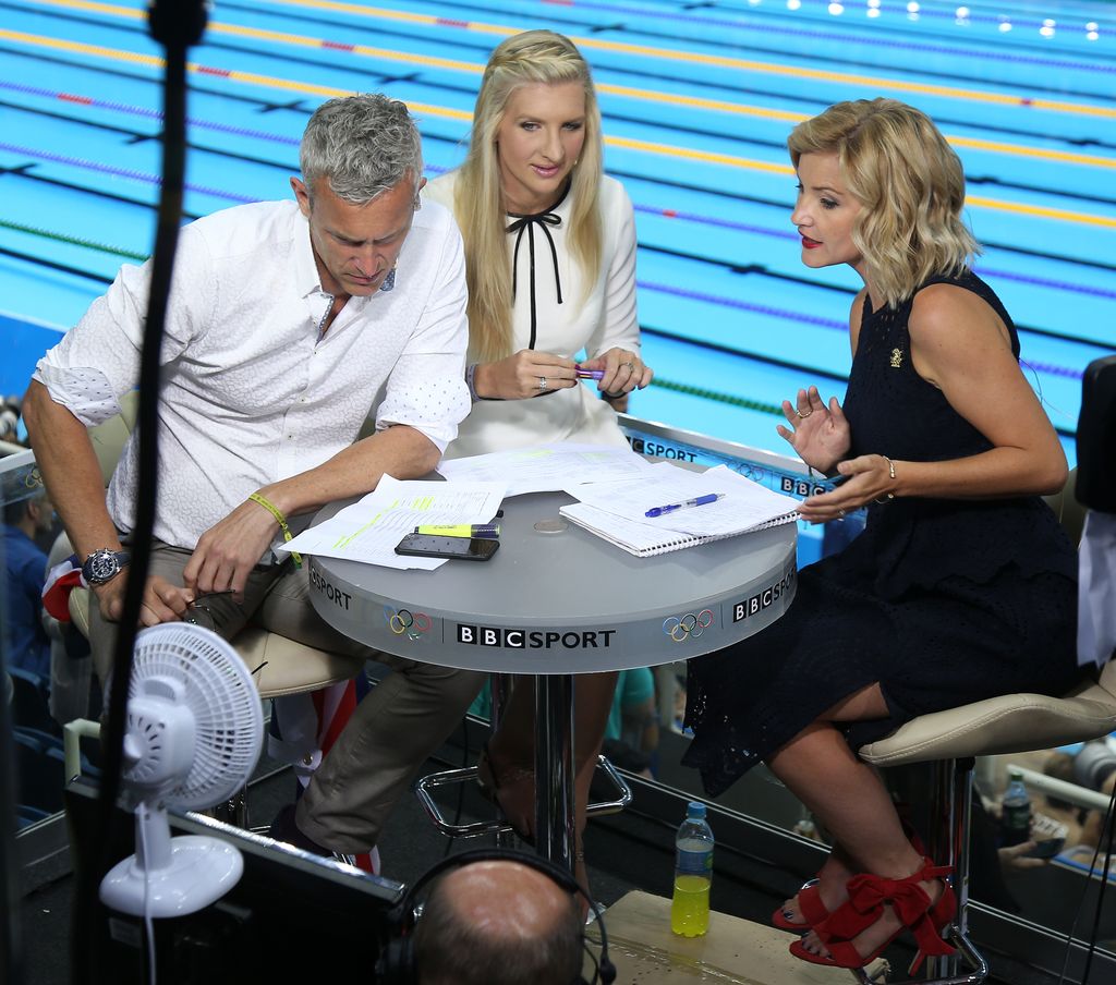 Mark Foster, Rebecca Adlington and Helen Skelton poolside at olympics