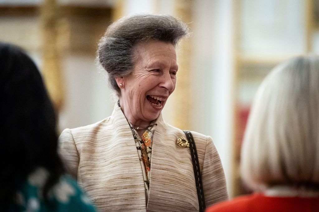 Princess Anne laughing inside Buckingham Palace