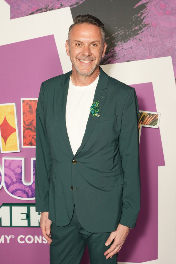 loren ruch in green suit