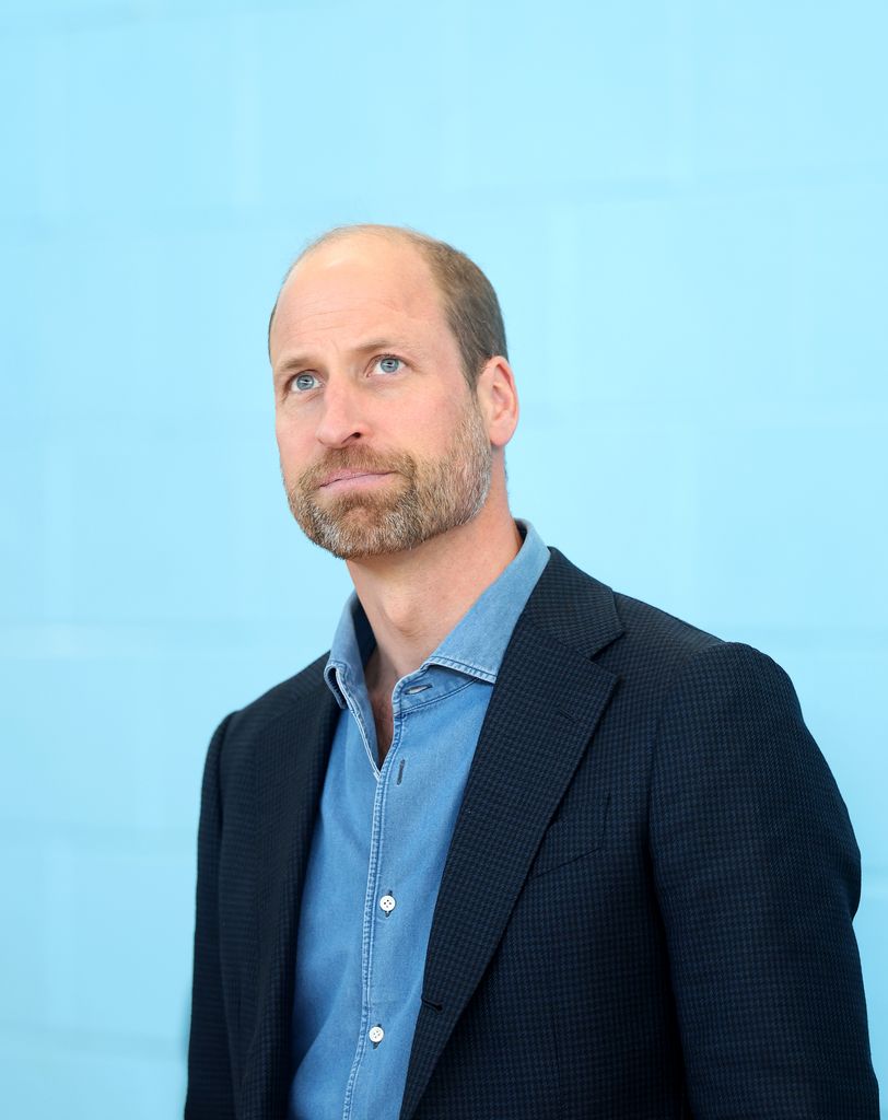 Prince William wearing blazer and denim shirt