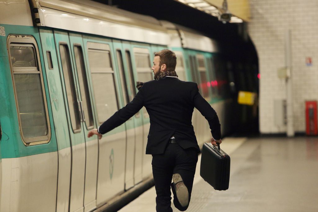 Man running for underground train