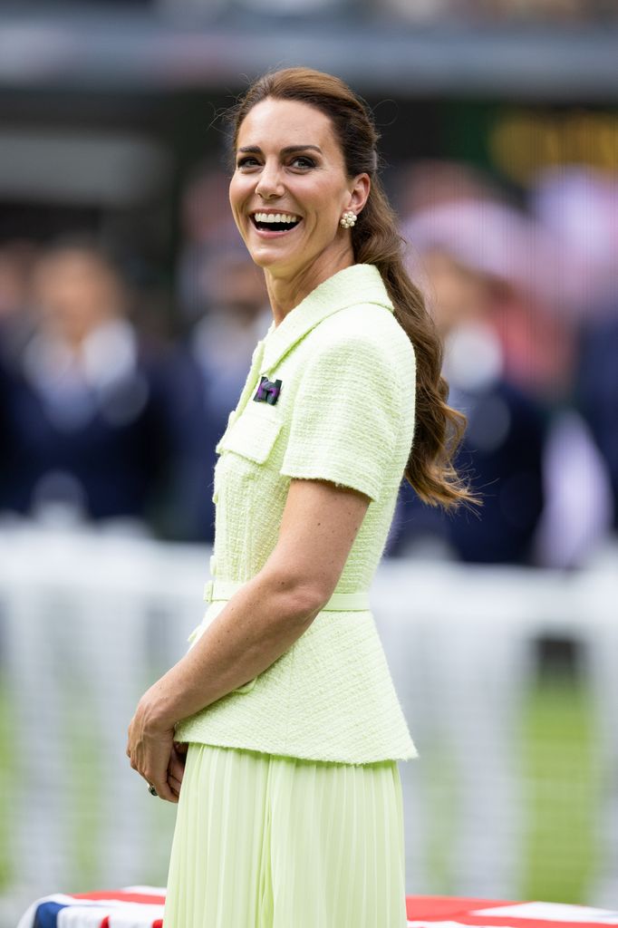 Catherine smiling over shoulder