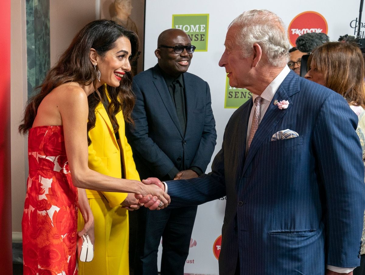 LONDON, ENGLAND - MAY 24: Prince Charles, Prince of Wales greets Amal Clooney at The Prince's Trust TK Maxx And Homesense Awards 2022 at Theatre Royal Drury Lane on May 24, 2022 in London, England. (Photo by Arthur Edwards - WPA Pool / Getty Images)