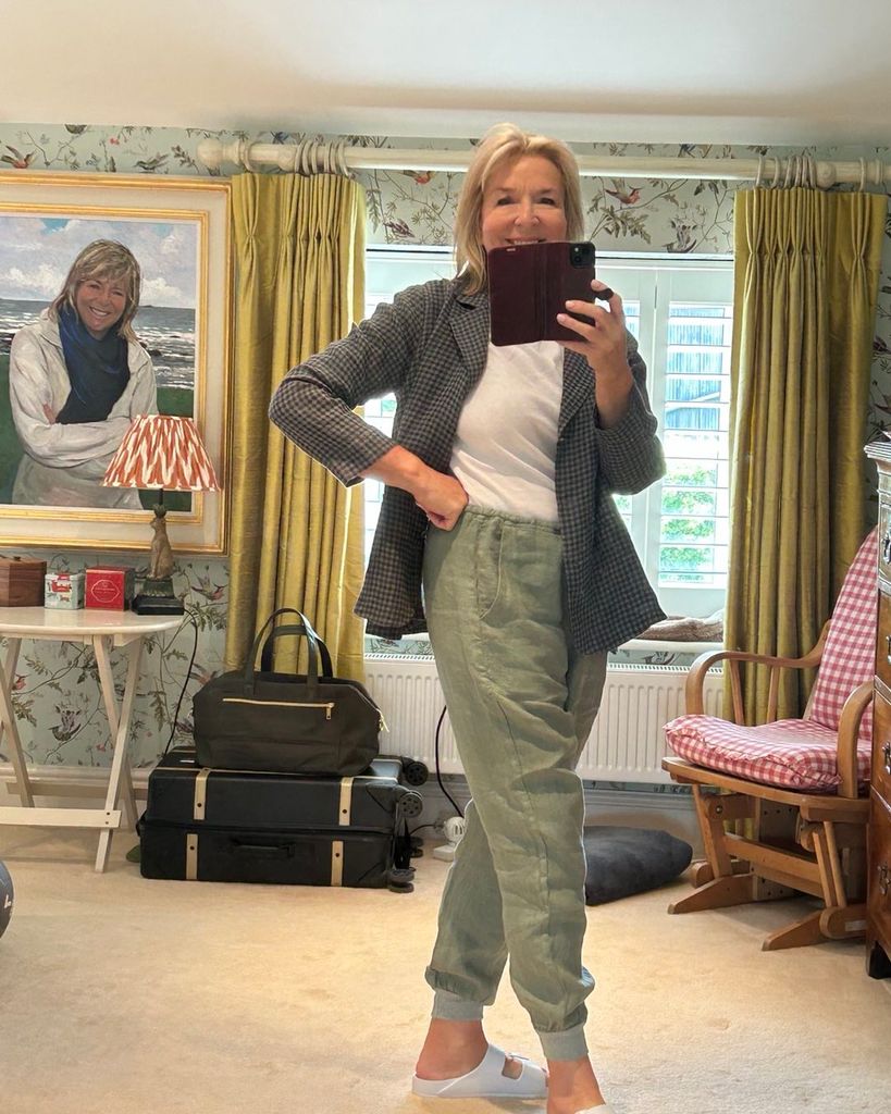 Fern Britton taking a mirror selfie in a casual summer outfit at home