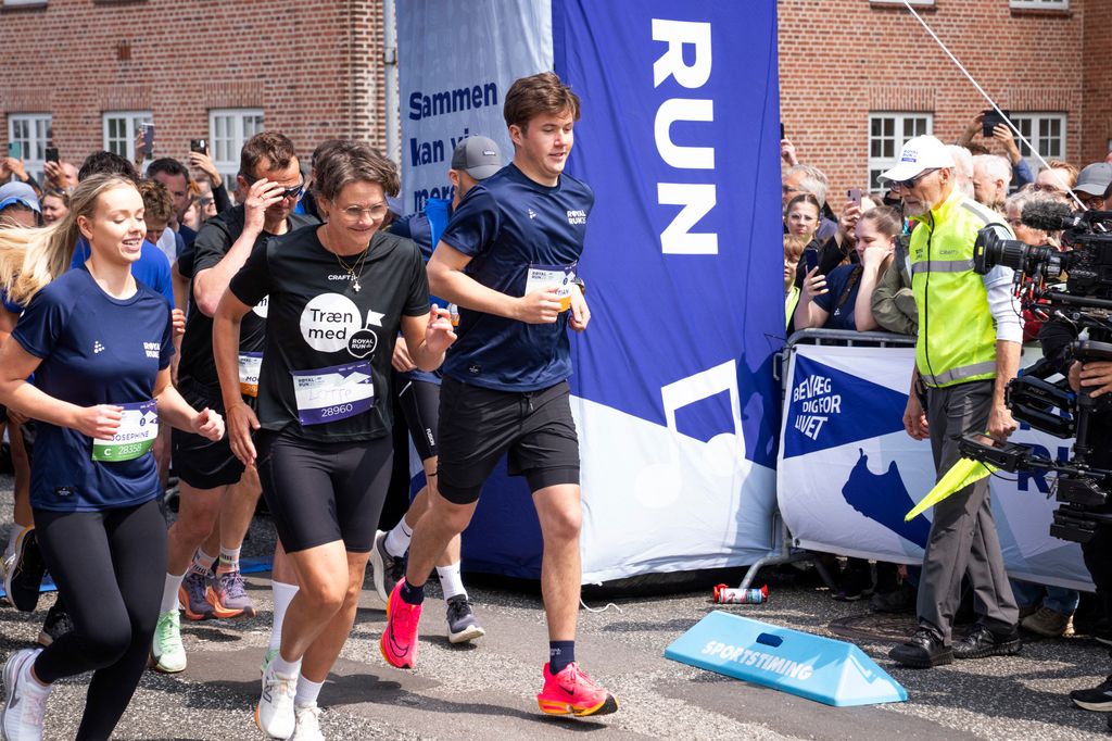 Crown Prince Christian wearing bright pink trainers during race