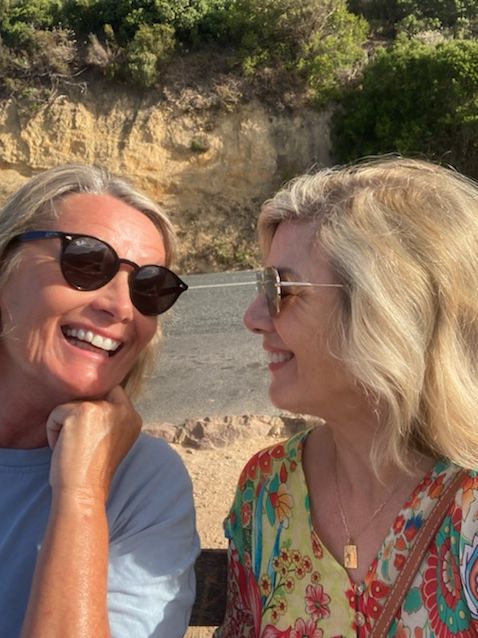 Glynis Barber and her sister having a big chat at the beach