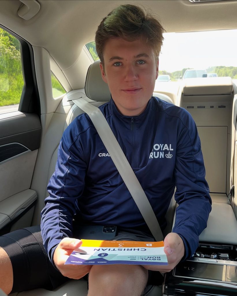 Crown Prince Christian wearing running kit in car