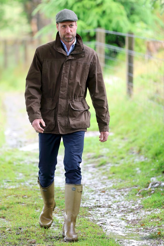 Prince William wearing flat cap and wellies