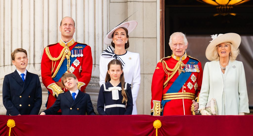 Prince George of Wales, Prince William, Prince of Wales, Prince Louis of Wales, Princess Charlotte of Wales, Catherine, Princess of Wales, King Charles III and Queen Camilla all standing next to each other during Trooping the Colour