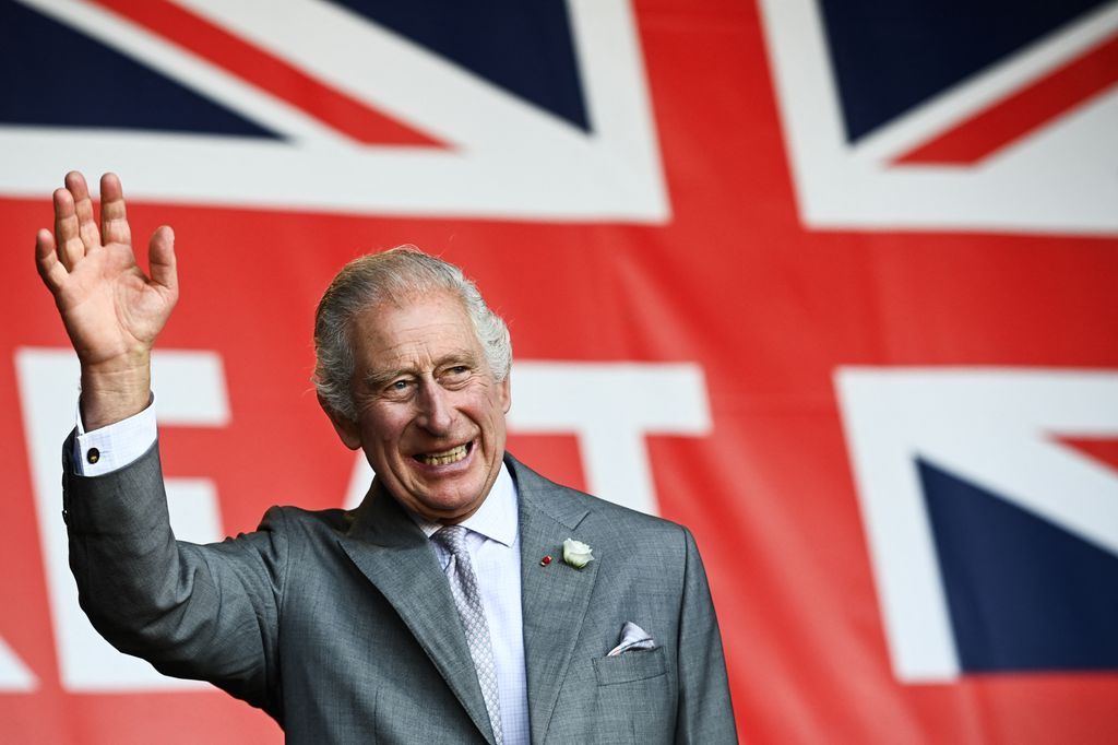 King Charles in front of union jack flag