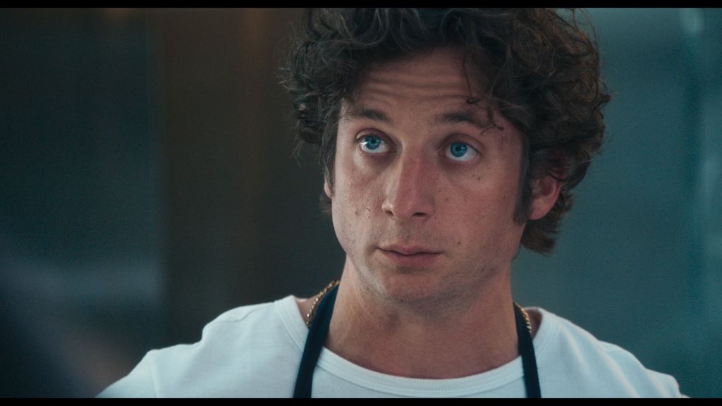 close-up of man in white top