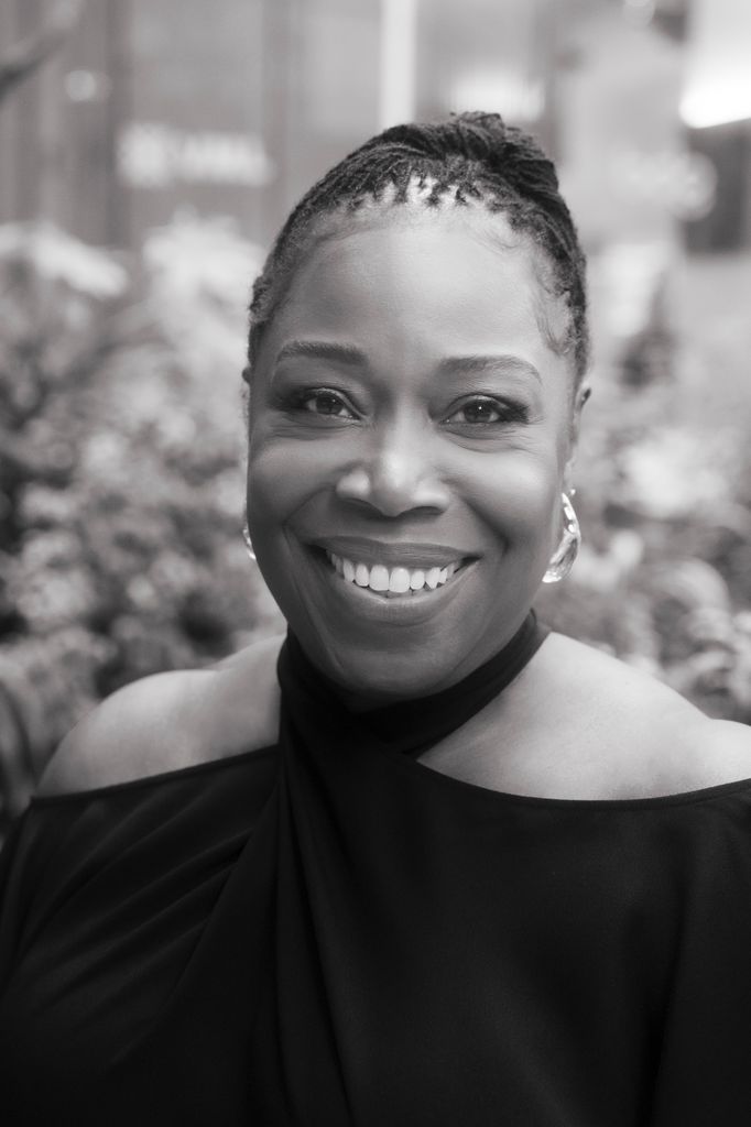 close-up of woman smiling wearing black dress