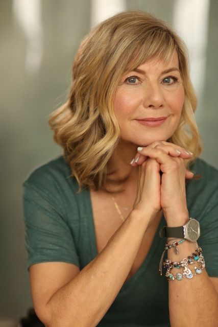 woman smiling in a dark top