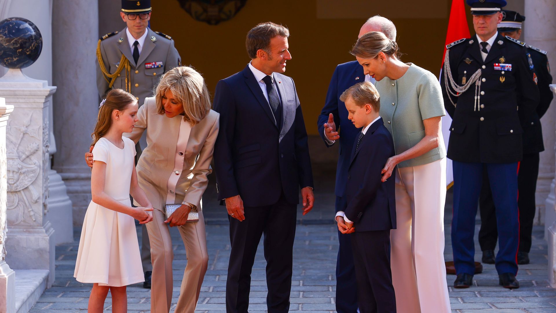 Princess Gabriella talking to Birgitte Macron, while Emmanuel Macron chats to Prince Albert, Princess Charlene and Prince Jacques