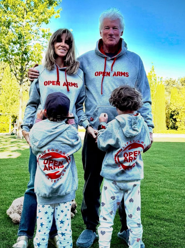 Photo shared by Richard Gere on Instagram featuring his wife Alejandra Silva and their two sons, all four wearing hoodies from the non-profit Open Arms