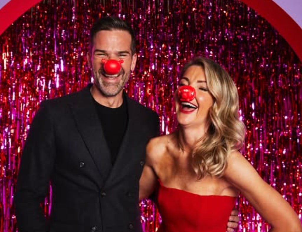 man and woman with charity red noses on