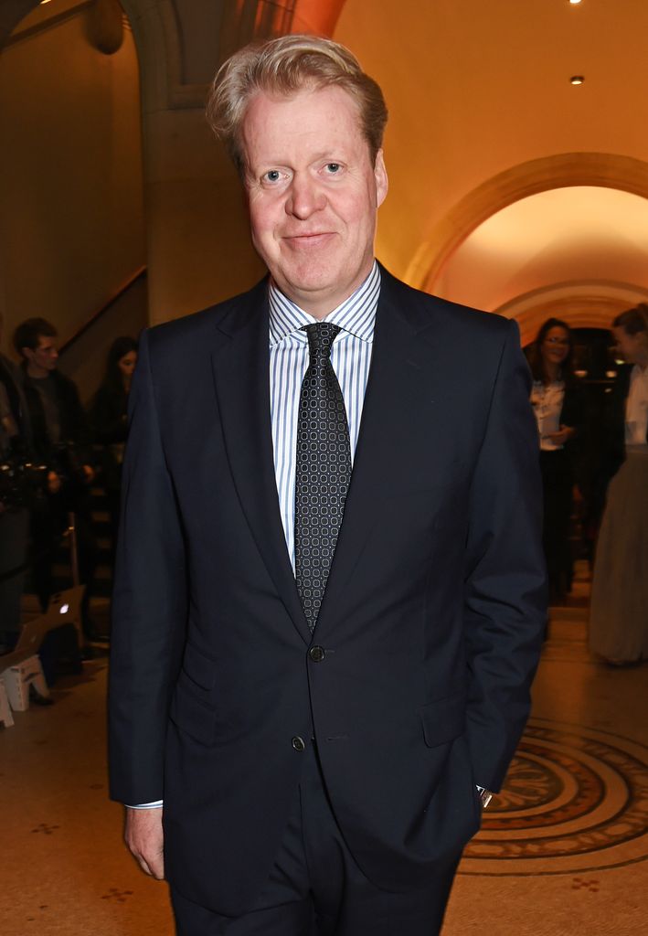Charles Spencer in a black suit