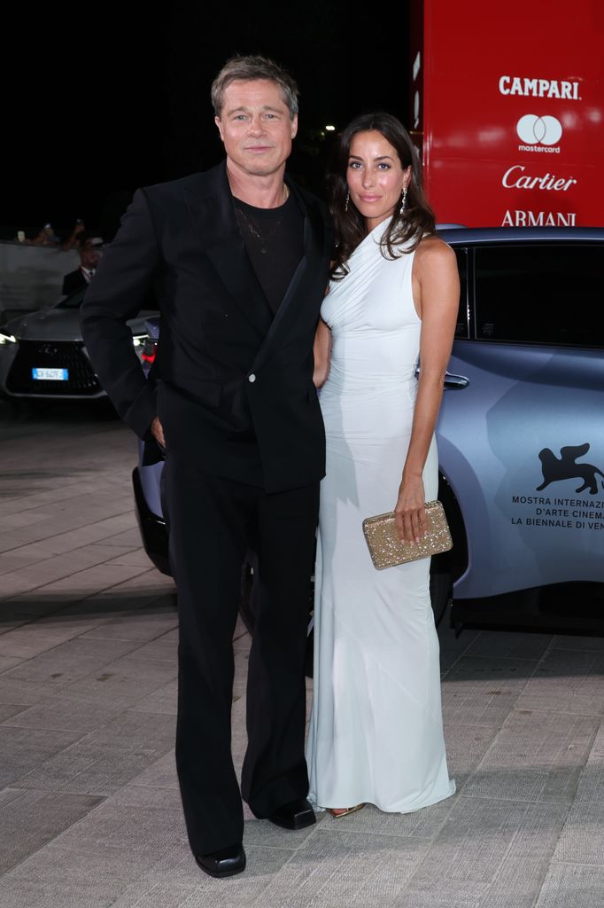  Brad Pitt and Ines de Ramon smiling 