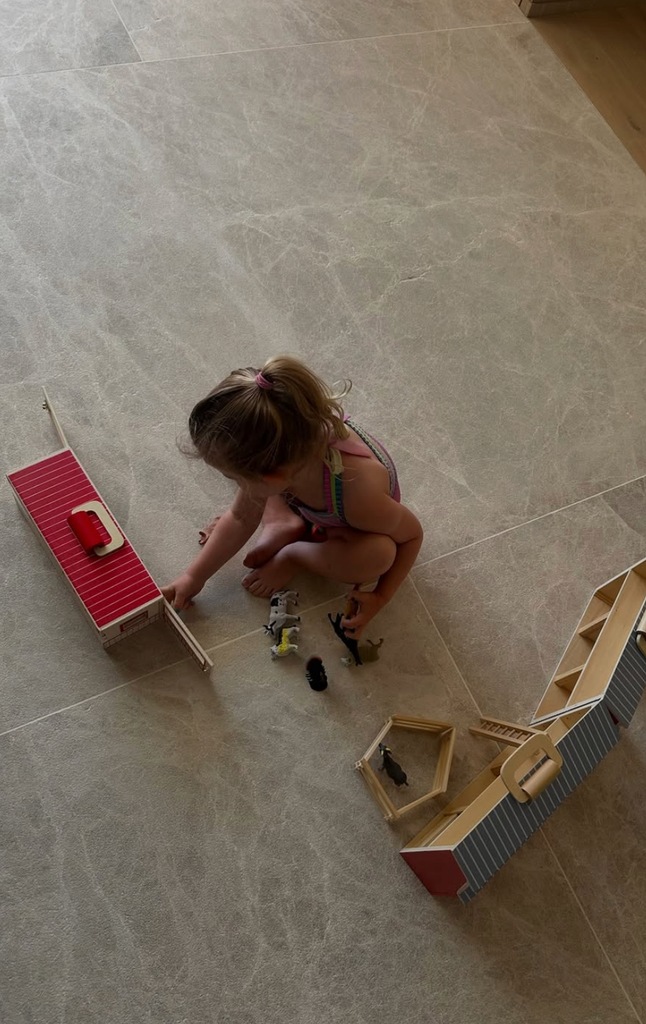 Photo shared by Katherine Schwarzenegger of one of her daughters playing with a doll house