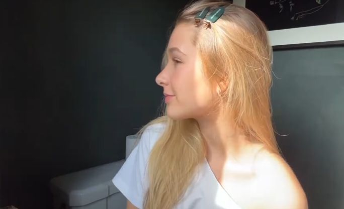 Harper side on in white tee