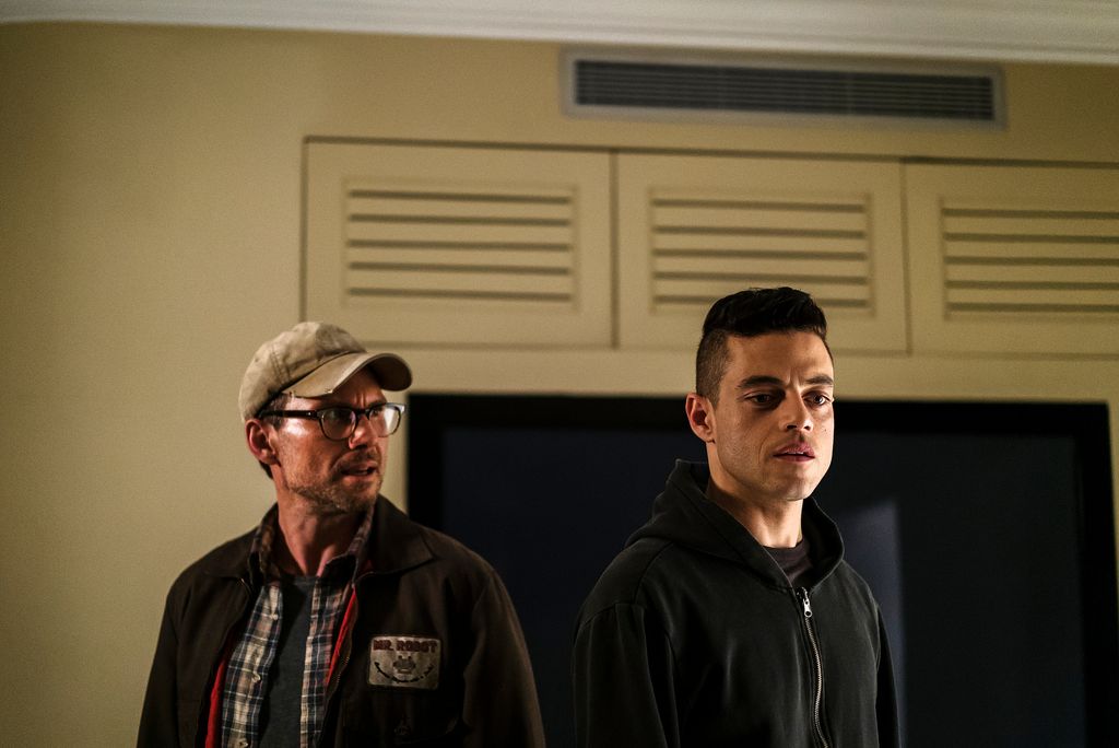 two men standing in house