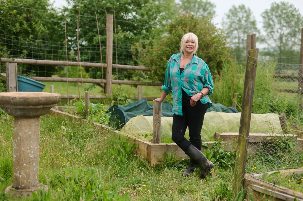 jo wood in her allotment in jeans and wellies 