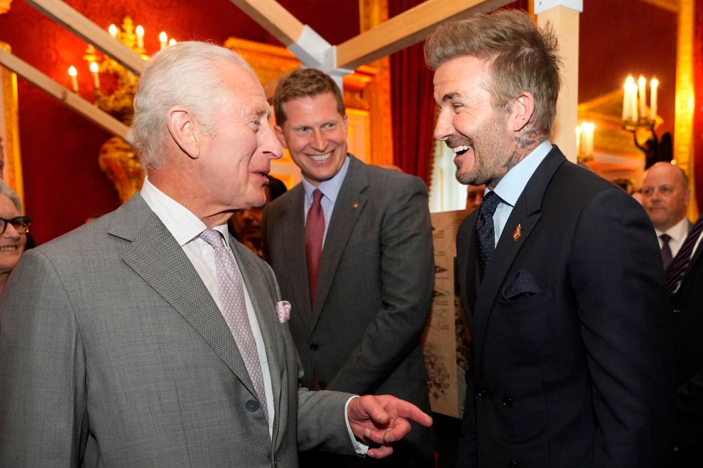 King Charles and David Beckham laughing together