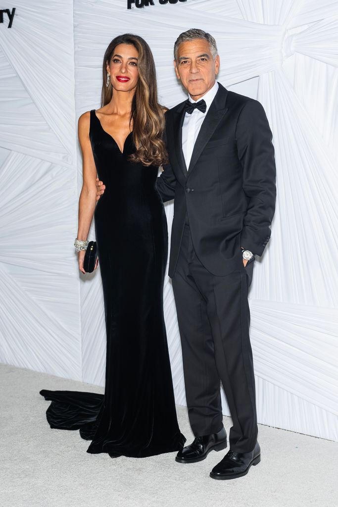 Amal Clooney (L) and George Clooney attend Clooney Foundation For Justice's The Albies at New York Public Library on September 26, 2024 in New York City