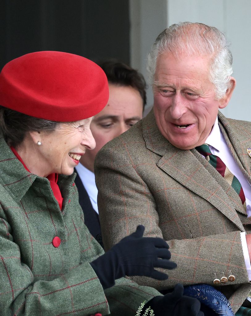Princess Anne laughing with King Charles