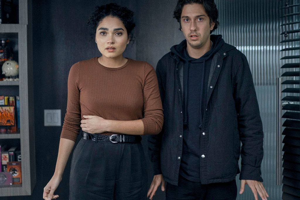 woman and man standing in office