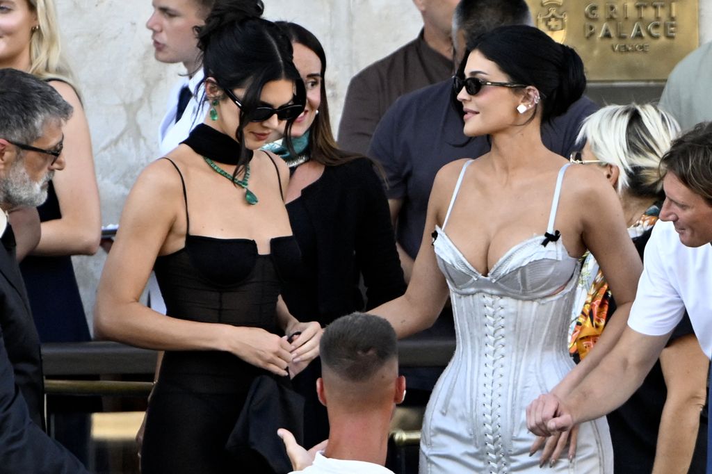 Kylie Jenner and US model Kendall Jenner leave the Gritti Palace Hotel on the wedding day of Amazon founder Jeff Bezos with Lauren Sanchez, in Venice on June 27, 2025. 