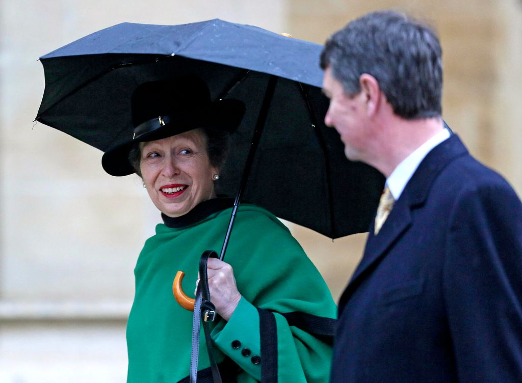 couple walking to church service in rain 