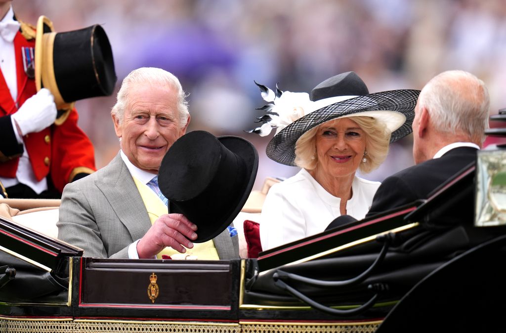 King Charles III (left) and Queen Camilla arrive by royal carriage during day five of Royal Ascot at Ascot Racecourse, Berkshire