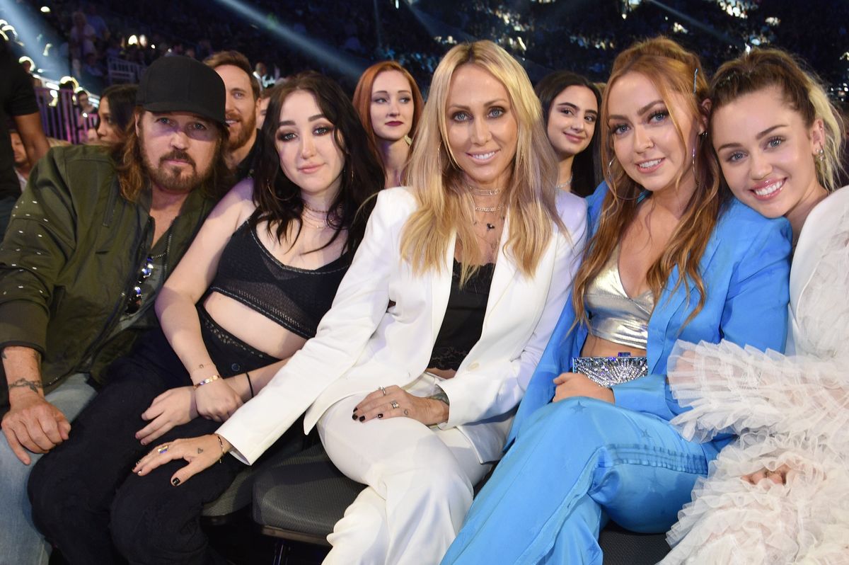 The tension started after the divorce of her parents, Tish and Billy Ray, which was finalized in 2022