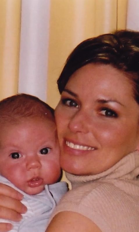 Shania Twain carrying a baby