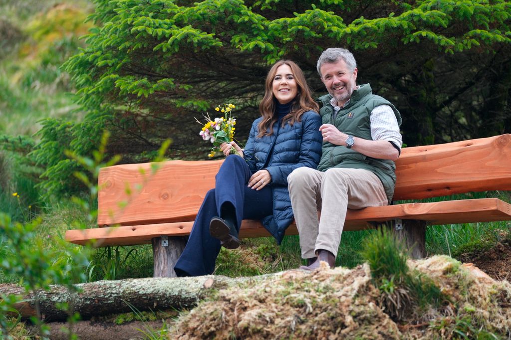 King Frederik and Queen Mary sitting on bench together