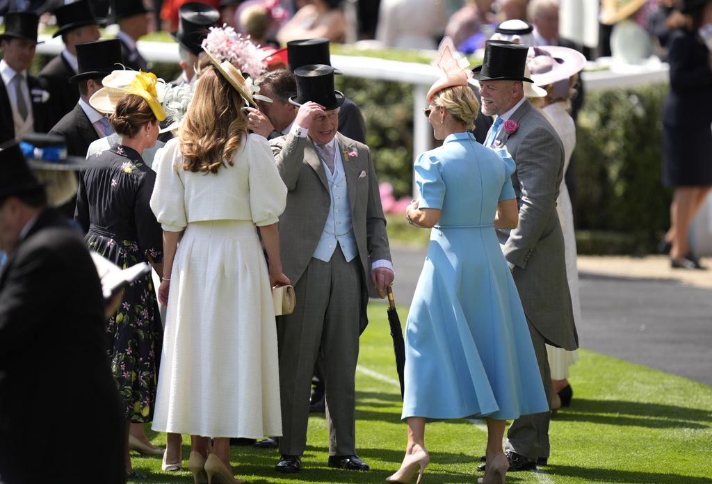 King Charles speaks with Zara Tindall and Mike Tindall