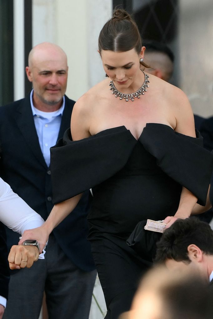 US model Karlie Kloss leaves the Gritti Palace Hotel on the wedding day of Amazon founder Jeff Bezos with Lauren Sanchez, in Venice on June 27, 2025