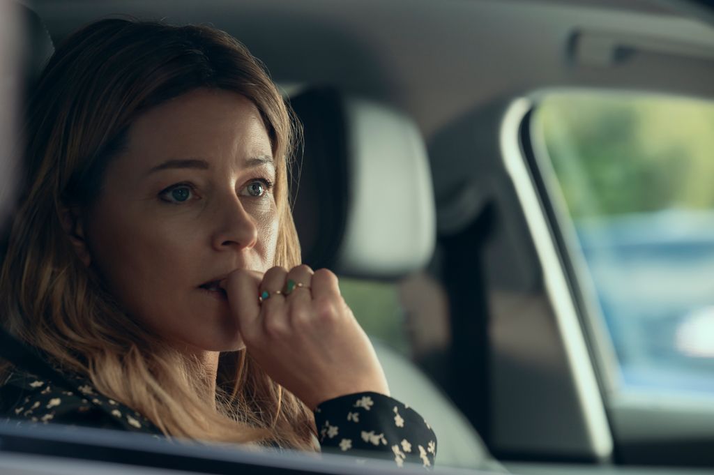 close-up of blonde woman sitting in car