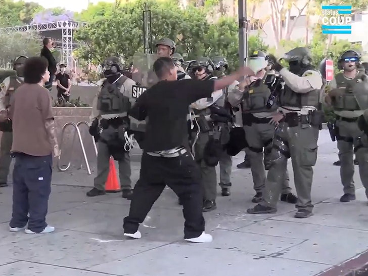 061225-protester-slam-bottle