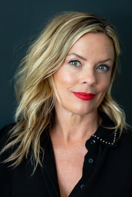 smiling blonde woman with red lipstick