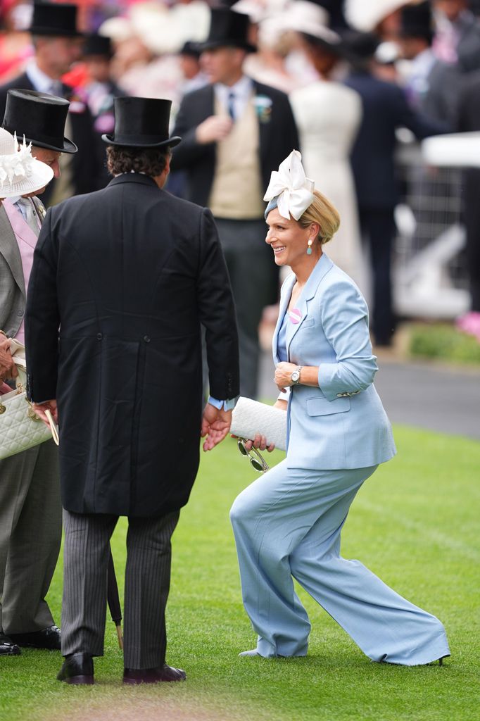 Zara Tindall performs a curtsy as she greets King Charles III and Queen Camilla 
