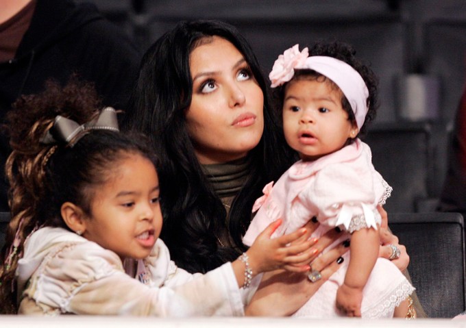 Vanessa holds on to her girls at the SuperSonics Lakers Basketball