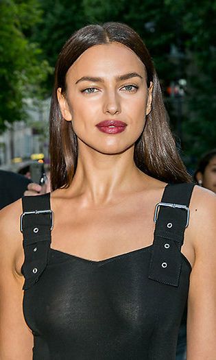 <b>Irina Shayk</b> showed off her gothic side when she teamed a bold dark berry lipstick with a high shine poker straight hairstyle.
<br>Photo: Getty Images