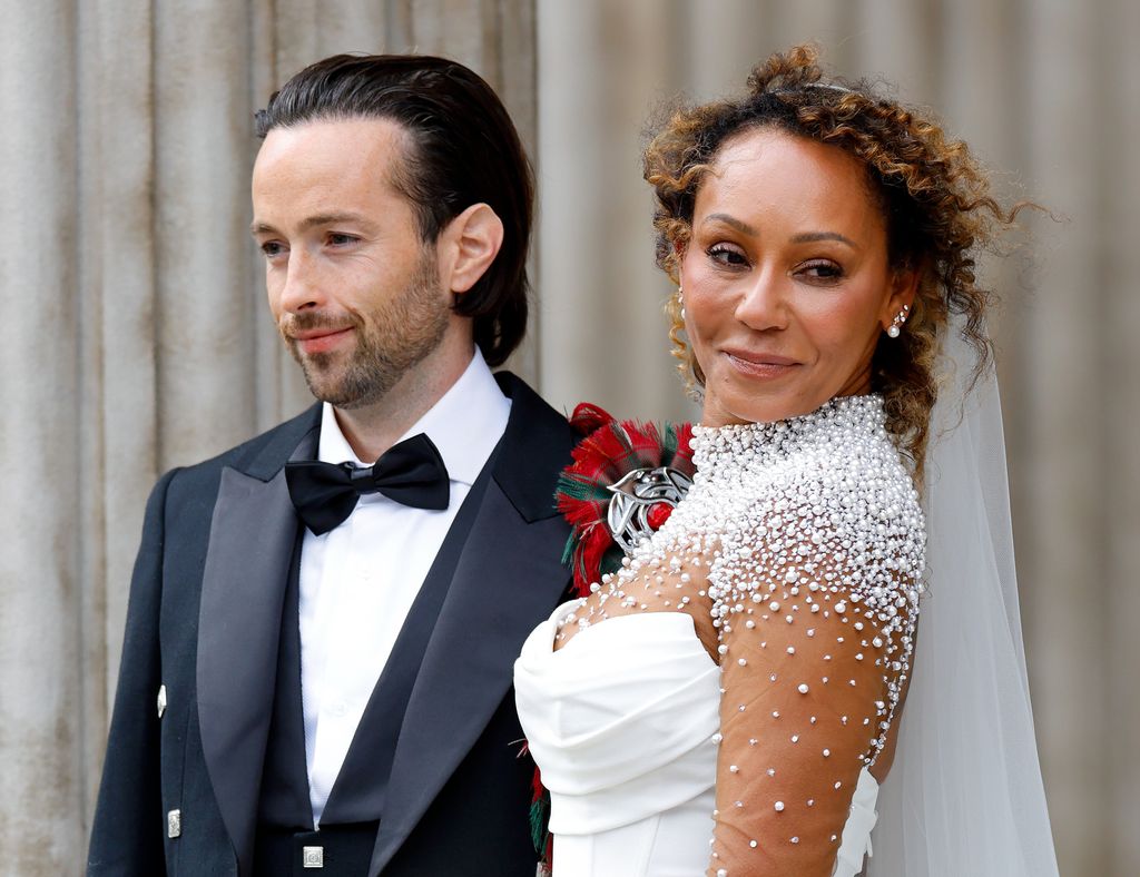 Rory McPhee and Mel B in wedding outfits shoulders up