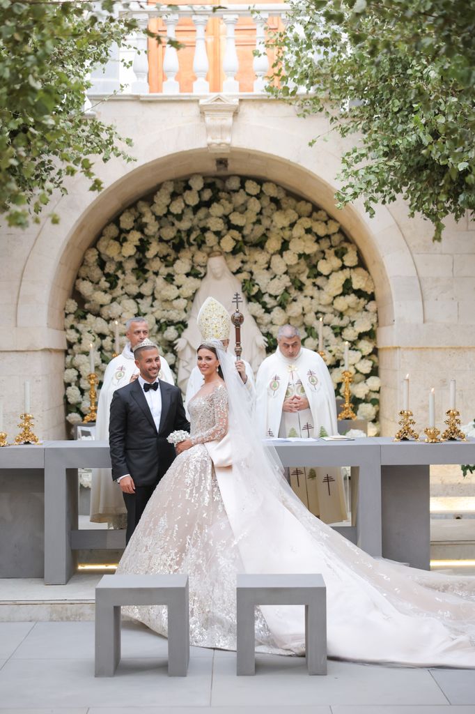 Celio Saab and Zein Qutami in front of three religious priests