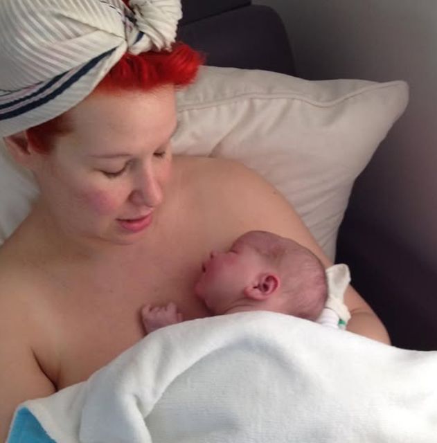 Angel Strawbridge holding a baby boy