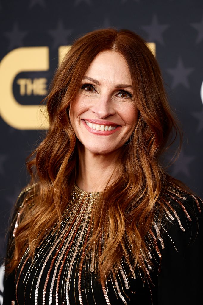 woman in black and gold dress